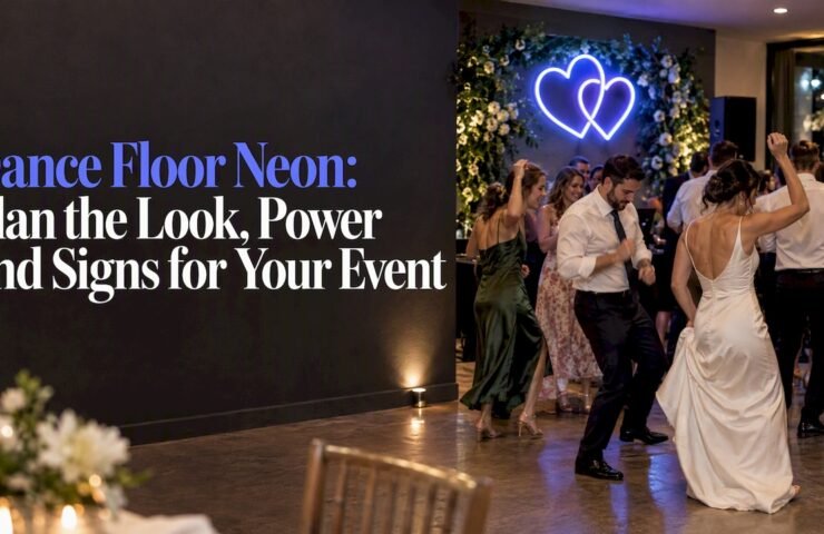 Guests dancing beneath a custom neon sign